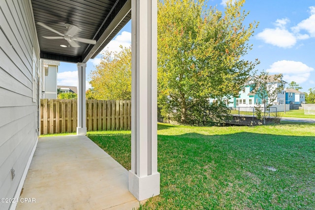 view of yard featuring a patio area and ceiling fan