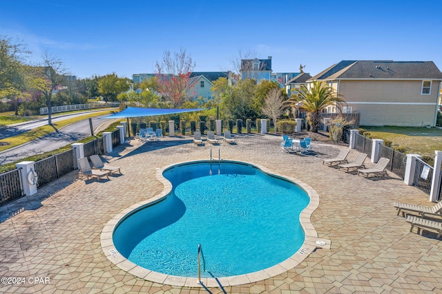 view of swimming pool featuring a patio area