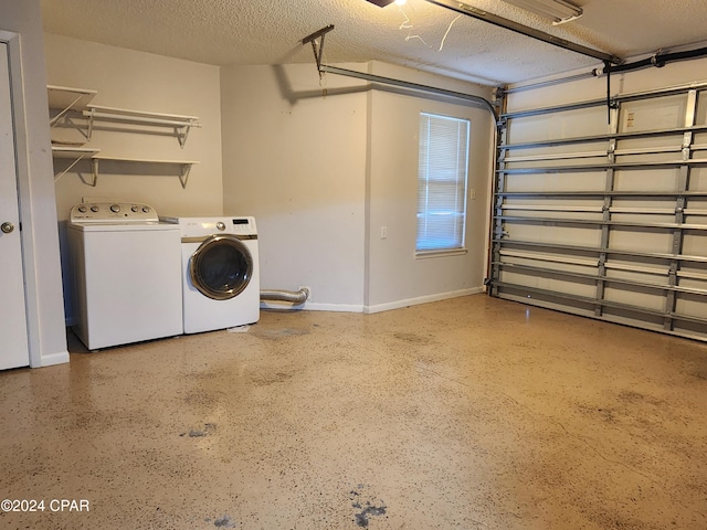 garage featuring washer and clothes dryer