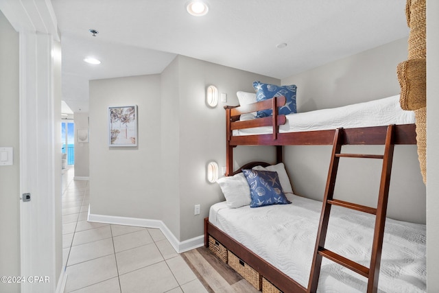 bedroom with light tile patterned floors