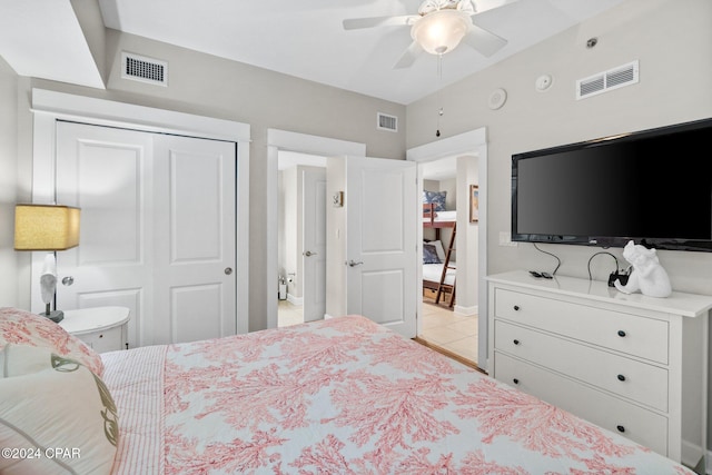 tiled bedroom featuring a closet and ceiling fan