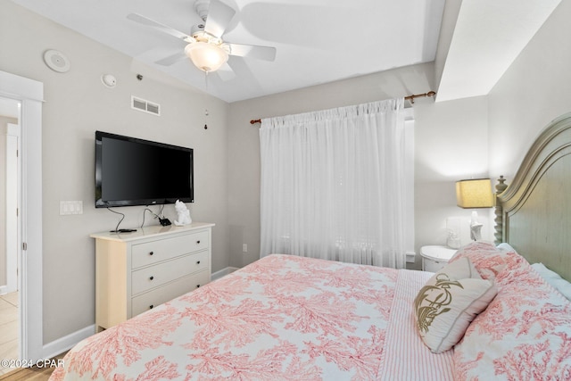 bedroom with ceiling fan and light hardwood / wood-style flooring