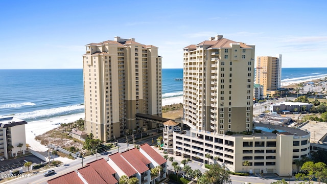 exterior space with a water view and a view of the beach