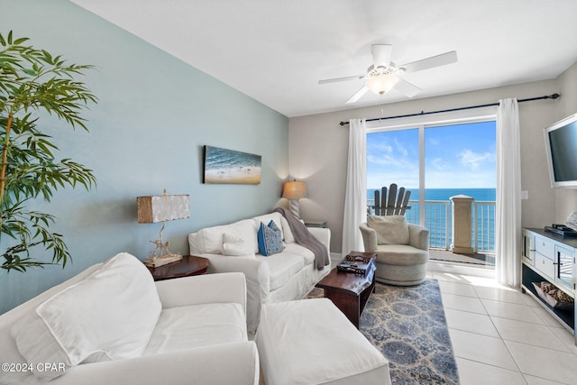 tiled living room with ceiling fan