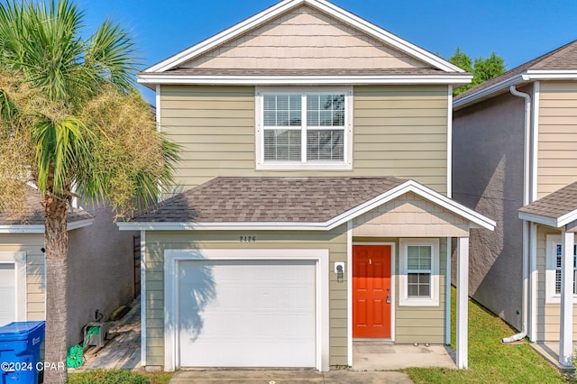 front of property with a garage