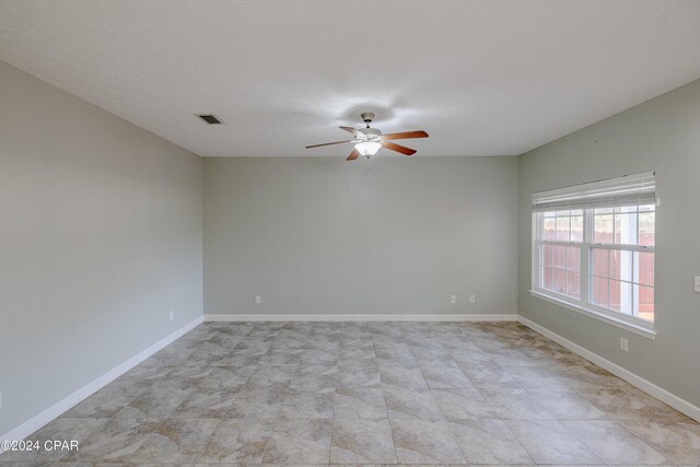 unfurnished room featuring ceiling fan