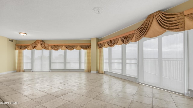 view of tiled spare room