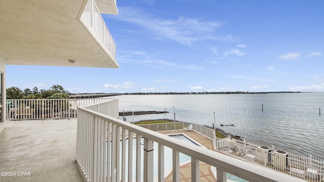 balcony featuring a water view