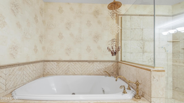 bathroom featuring tiled bath