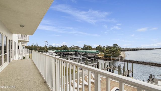 balcony featuring a water view