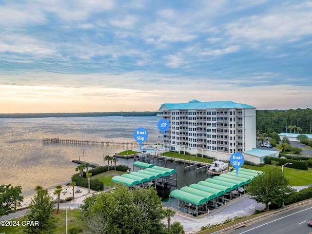 aerial view at dusk with a water view