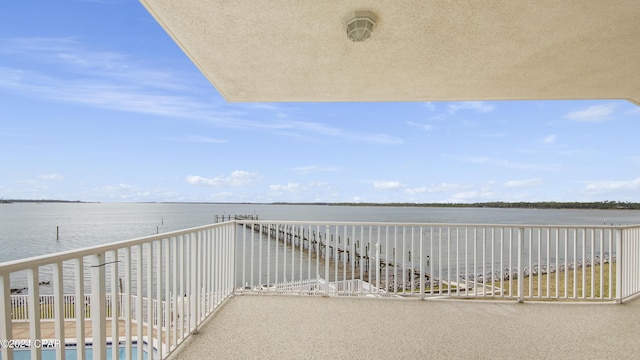 balcony featuring a water view