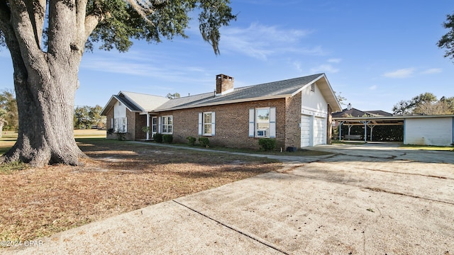 view of front of property featuring a carport