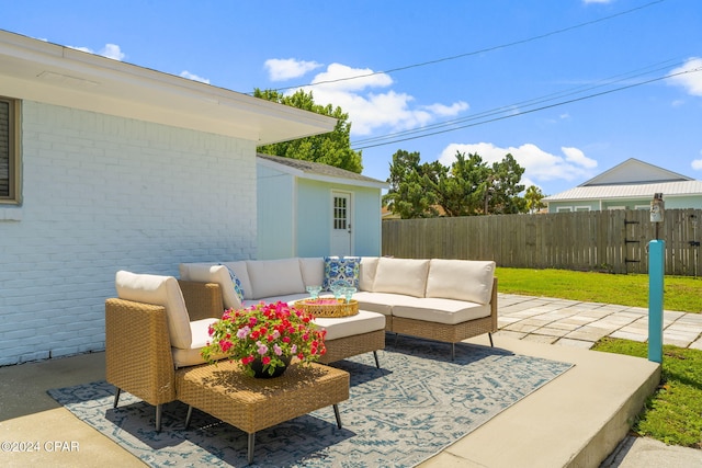 view of patio featuring fence and an outdoor hangout area