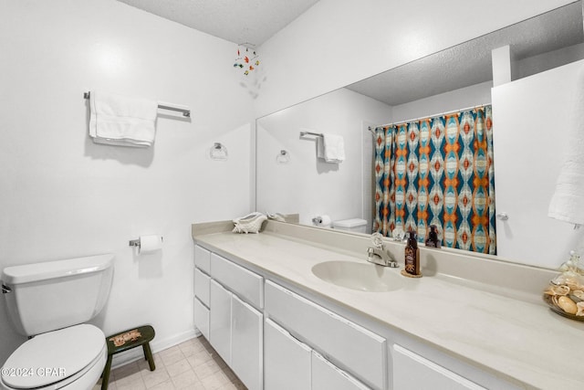 bathroom featuring vanity, toilet, a textured ceiling, and walk in shower