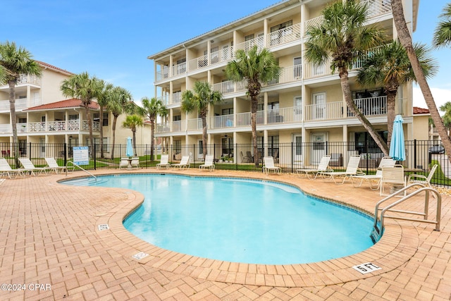 view of swimming pool featuring a patio