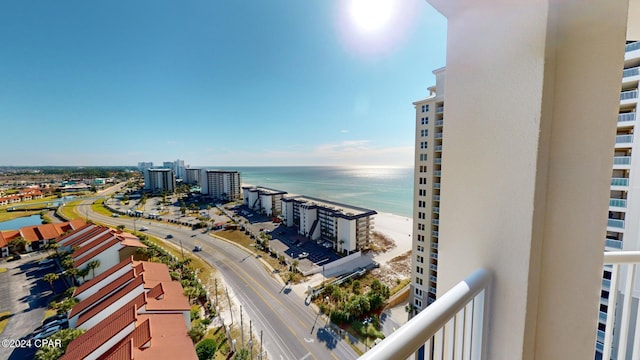 exterior space featuring a water view and a beach view