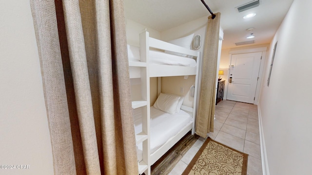 bedroom with tile patterned floors