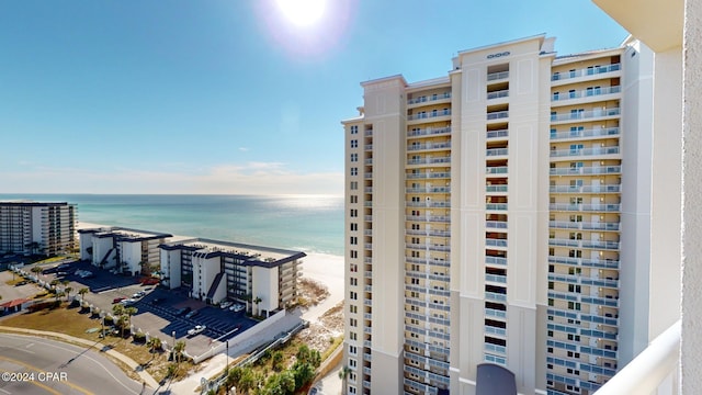 view of property featuring a water view and a view of the beach