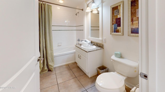 full bathroom featuring tile patterned floors, vanity, toilet, and tiled shower / bath