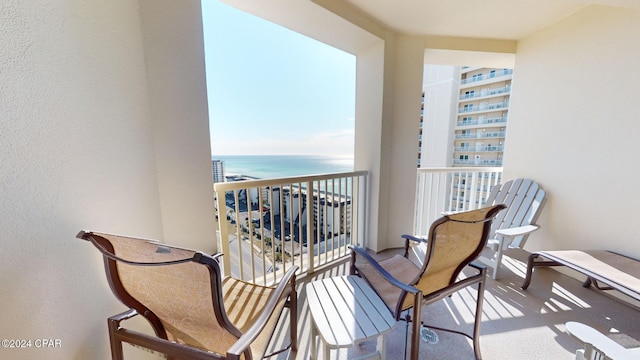 balcony featuring a water view