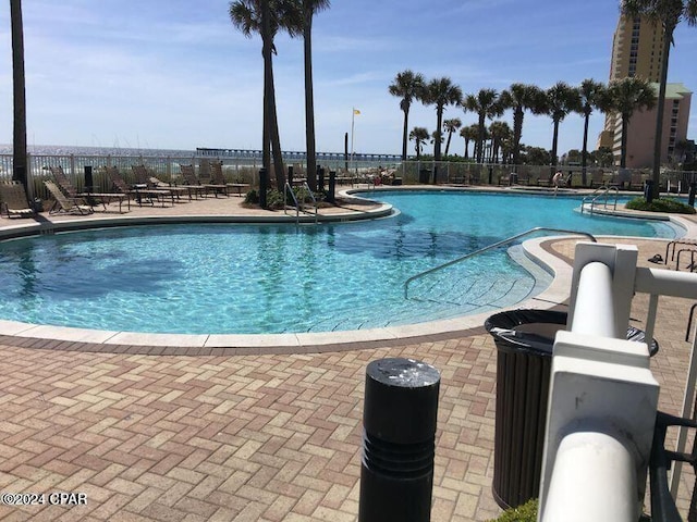 view of swimming pool with a patio area