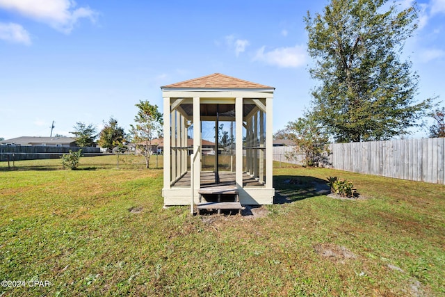 view of outdoor structure with a yard