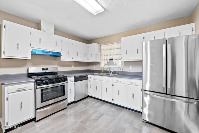 kitchen with white cabinetry, sink, a textured ceiling, and appliances with stainless steel finishes