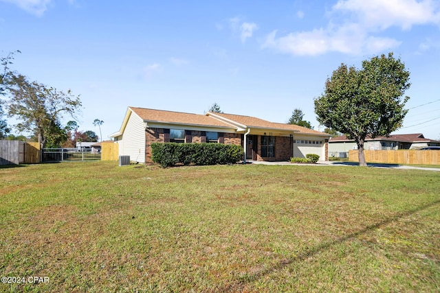 ranch-style home with central AC, a front yard, and a garage