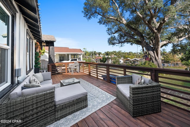 wooden deck with outdoor lounge area