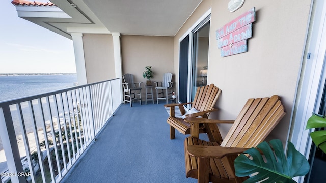 balcony featuring a water view