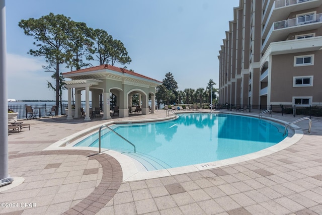 view of swimming pool featuring a patio area