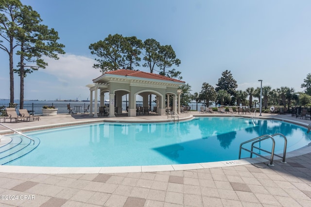 view of swimming pool featuring a patio area