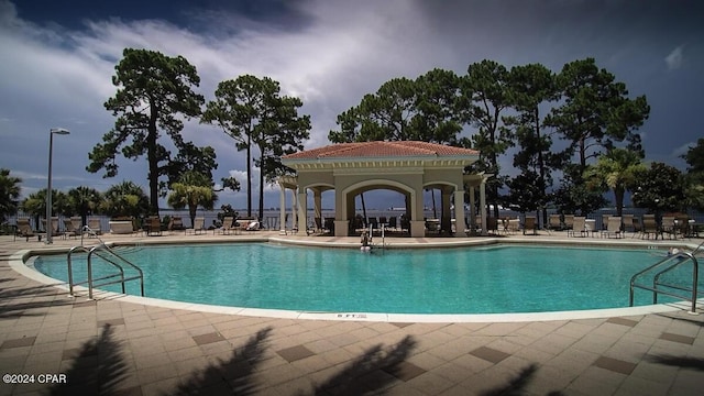 view of swimming pool with a patio