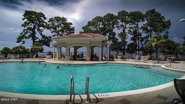 view of swimming pool featuring a patio