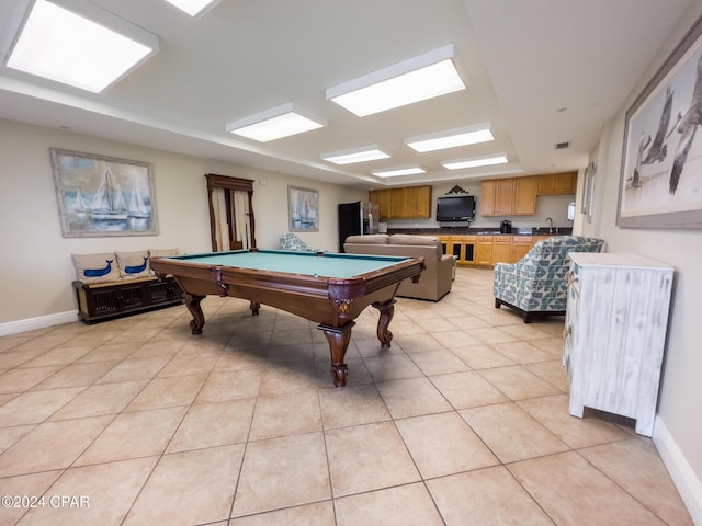 recreation room with light tile patterned flooring, sink, and pool table