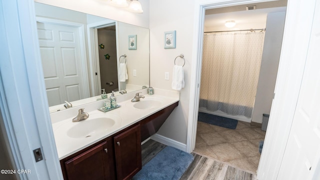 bathroom with wood-type flooring and vanity