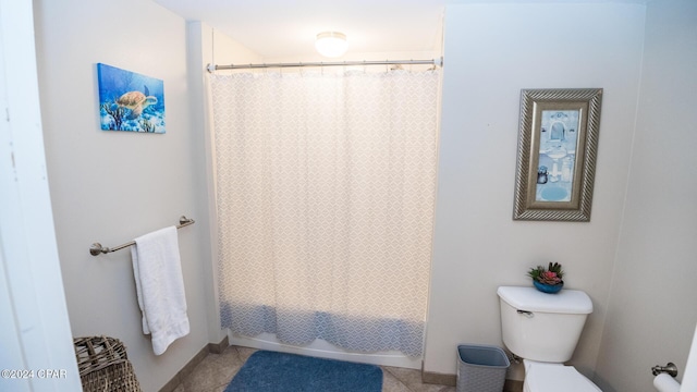 bathroom with toilet and shower / tub combo