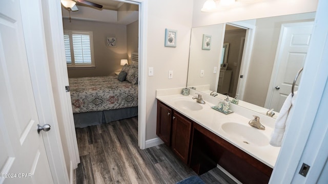 bathroom with hardwood / wood-style flooring, vanity, and ceiling fan