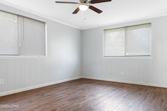 empty room featuring hardwood / wood-style floors, ceiling fan, and crown molding