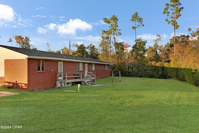 view of yard featuring a deck