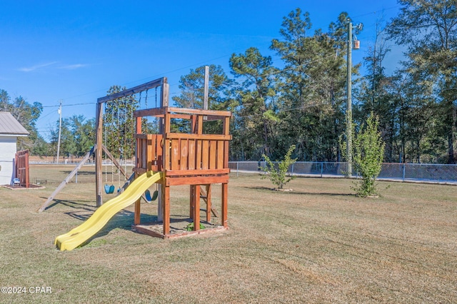 view of playground featuring a lawn