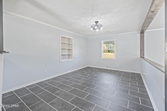 spare room with crown molding