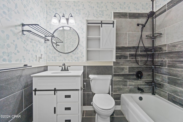 full bathroom with vanity, toilet, and tiled shower / bath