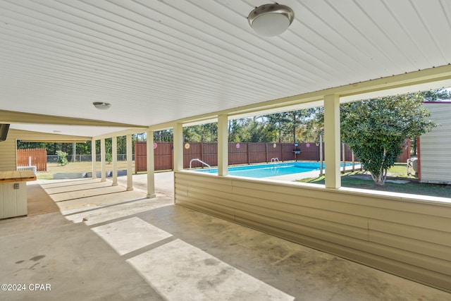 view of patio / terrace featuring a fenced in pool