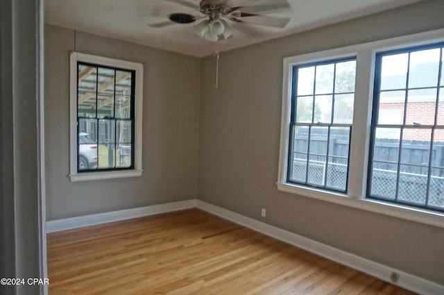 unfurnished room featuring light wood-type flooring and ceiling fan