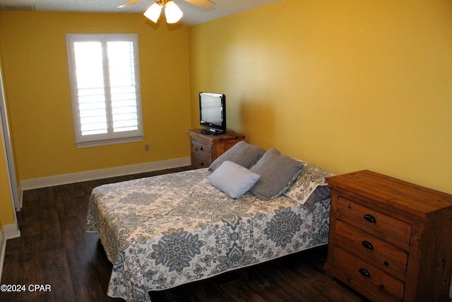 bedroom featuring dark hardwood / wood-style floors and ceiling fan