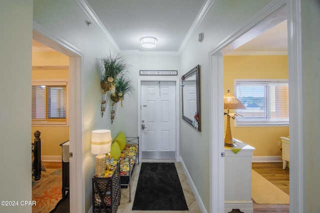 hall featuring light wood-type flooring and ornamental molding