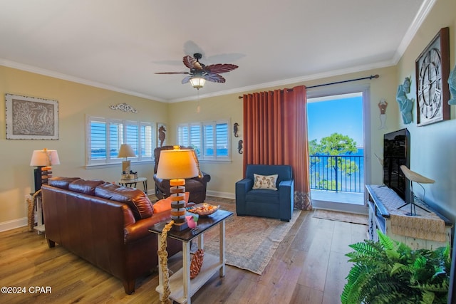 living room with ceiling fan, light hardwood / wood-style floors, and crown molding