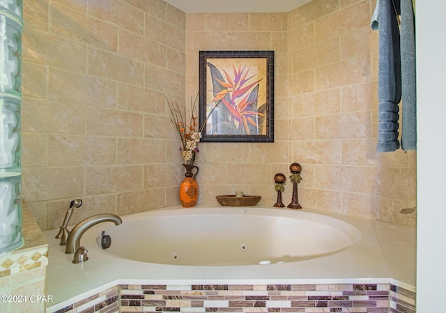 bathroom with tiled bath